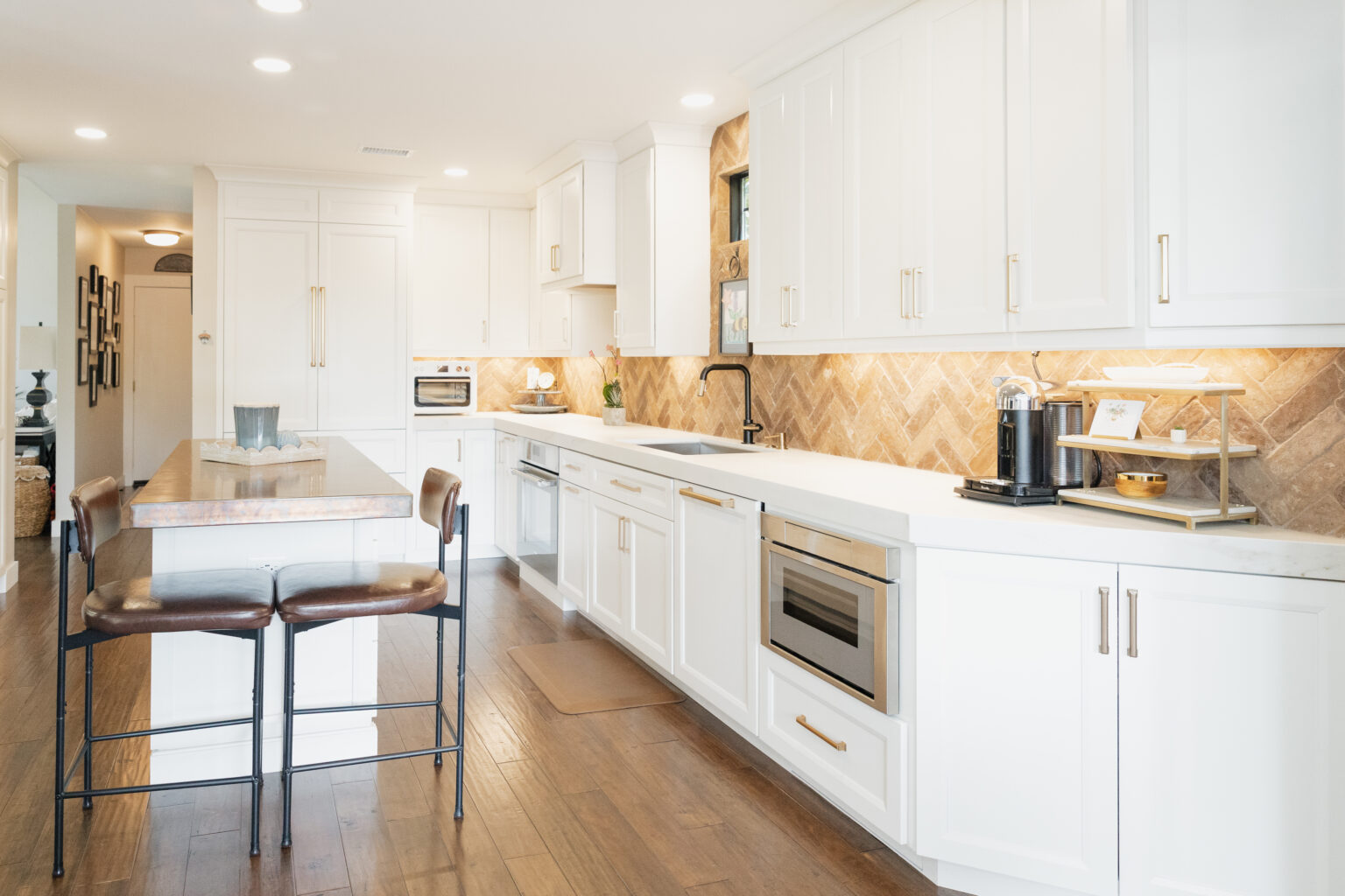White Kitchen with Herringbone Backsplash by Home Remodeling Center