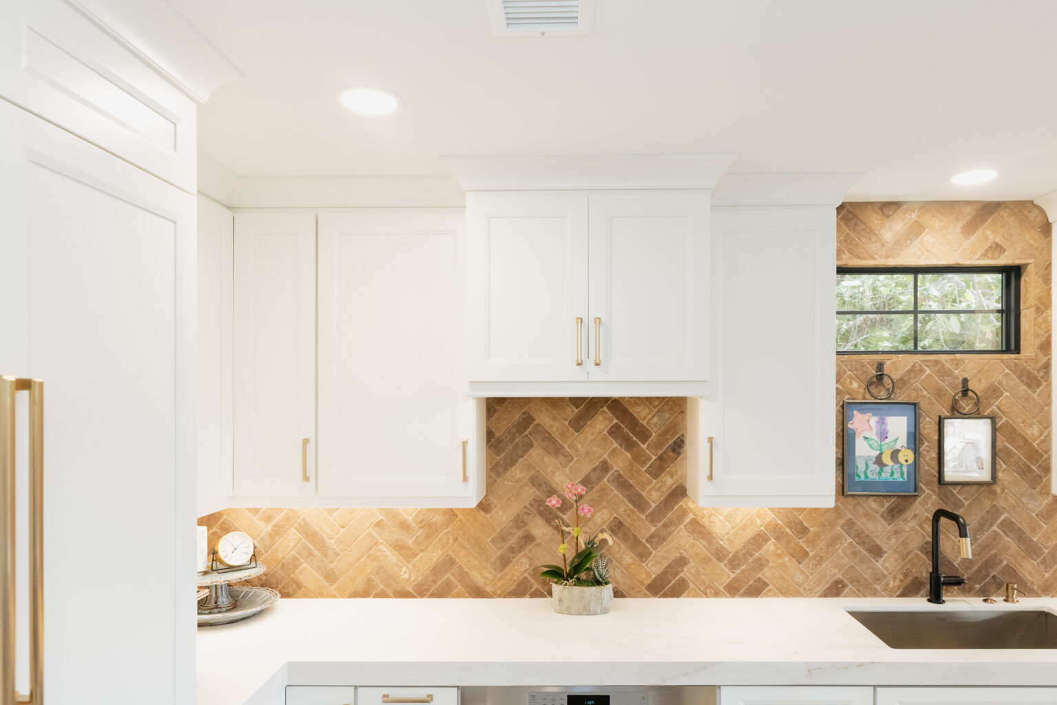 White Kitchen with Herringbone Backsplash by Home Remodeling Center